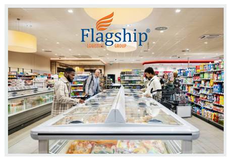 A grocery store aisle with three people shopping. Overhead is the logo of Flagship Logistics Group, showing their branding in the store.